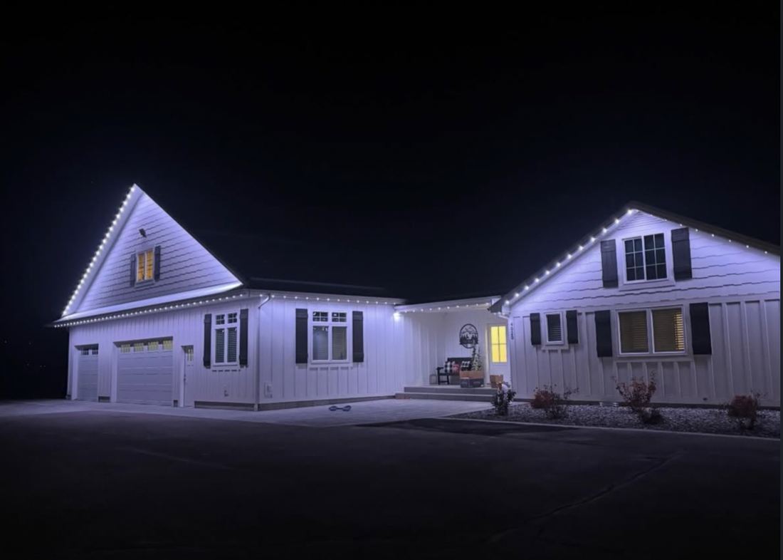 A Vantage Lighting Systems permanent LED install shown in clean warm white along a roofline
